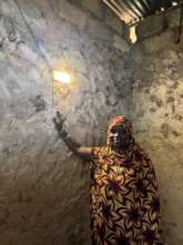 lighting a home in Ukongoroni Village.