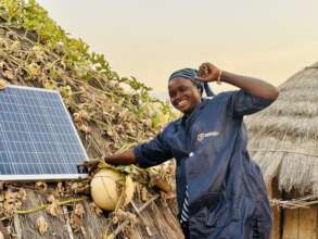 Solar mama installs home lighting system, Senegal