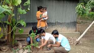 Tree planting with child guardian and GCO team