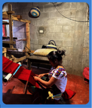 Maria working at her loom at night