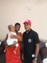 Mercy and her child receiving financial support