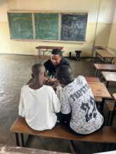 UP Zambia staff playing puzzles with children