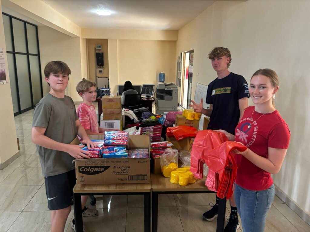 Volunteers helping pack gifts