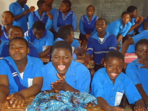 students sitting /singing  during moral education