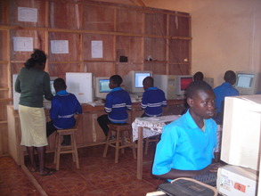 OVCs at  the Computer Lab with their teacher