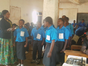 Students standing and singing a Christmas song