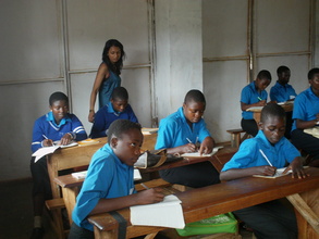 The OVCs busy writing English in class