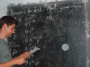 A Volunteer teaching the Orphans