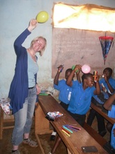 laura with the students in the field for sports.