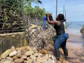 Team working on repairs on the damaged fence