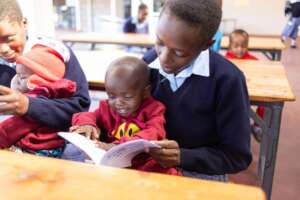 Y. reading to her daughter
