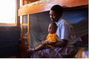 Joy with her son at Neema