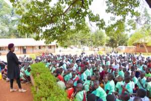 A Neema Counselor with Local School Children