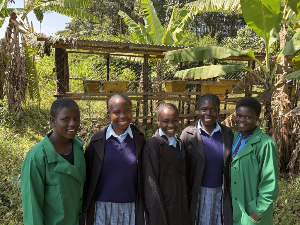 Neema Students in front of beehives