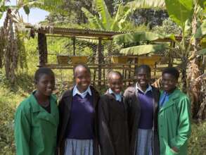Neema Students in front of beehives