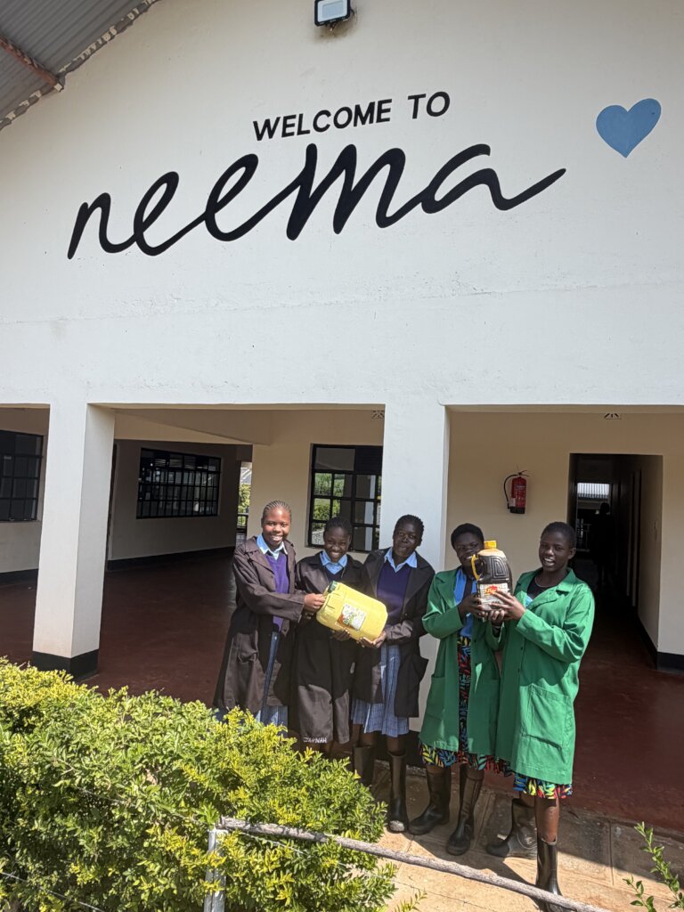 Neema agribusiness students with first honey