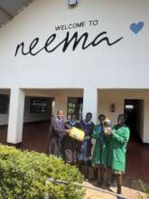 Neema agribusiness students with first honey