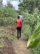 Student and teacher walking the farm