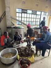 Girls preparing food at Neema