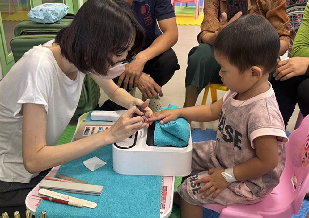 Children participating in the nail event