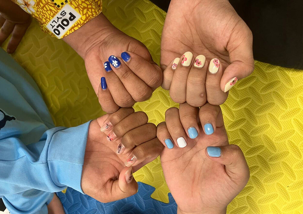Children showing each other their nails