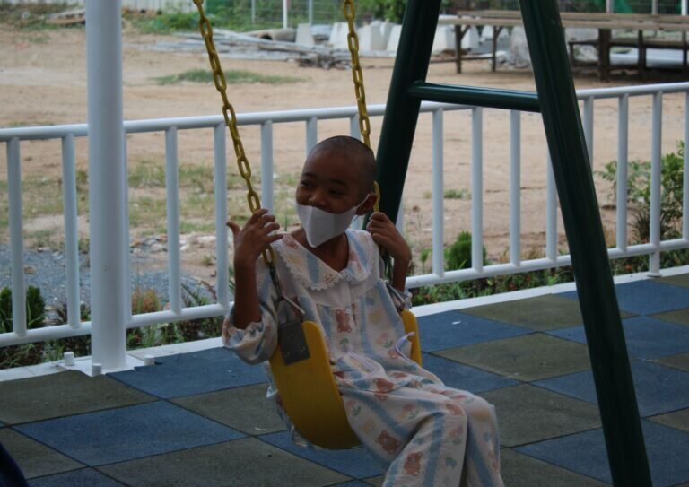 A Child enjoying swings