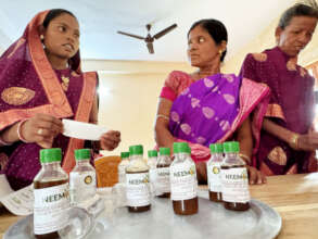 Bottling Neemola oil at the office in Despalla