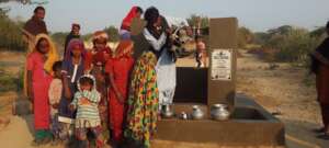 Children collecting water for households