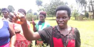 This lady was lucky to find a straw berry fruit