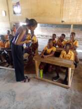 donor interacts with children