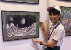 Nay Moe Aung with his artwork