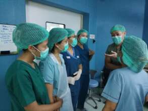 Dr. Fukui communicating with operating room staff,