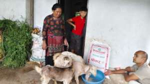 Gumati with family member and her goats