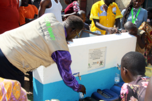 Bishop, the board chairperson collecting water