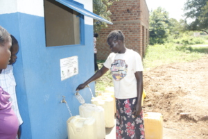 Women fetching water from a water kiosk