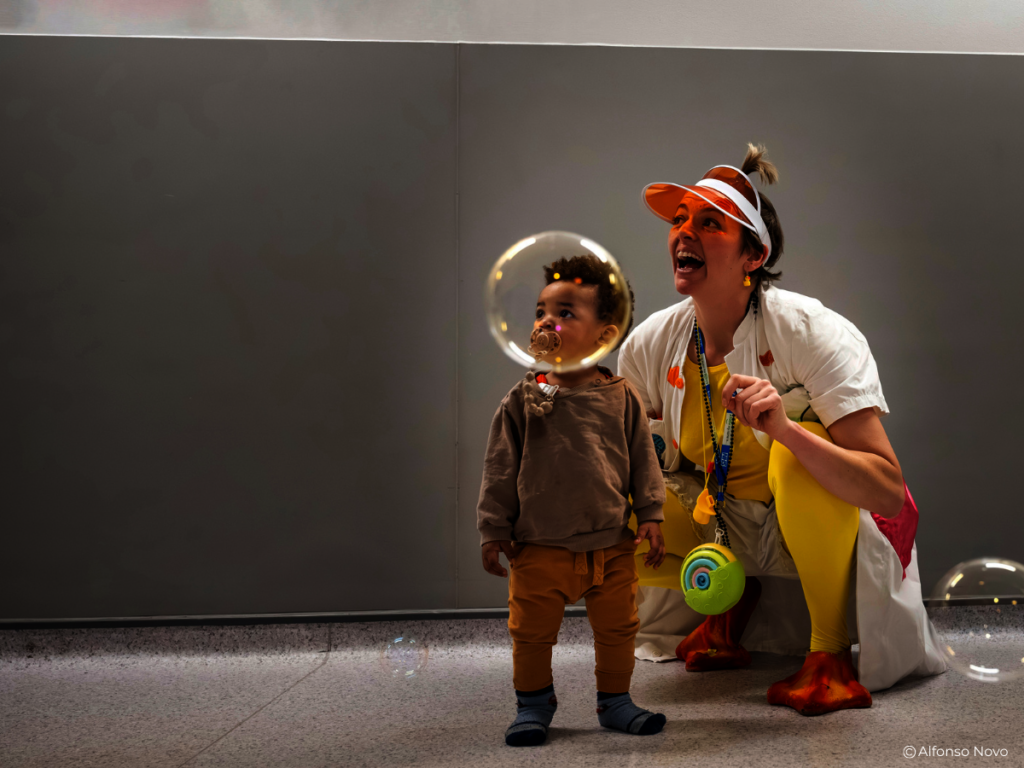 Dr Dilly Dally and child playing with bubbles