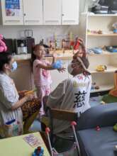 Dr Geehee visiting a child at the Royal Alex
