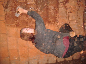 Nancy a volounteer  plastering the wall seriously