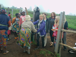 Cross section of women with volunteers at the site