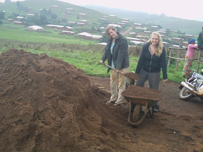 Volunteers carrying sand for the plastering