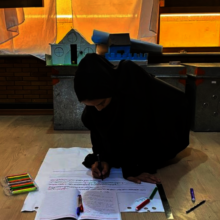 Afghan girl working on a project