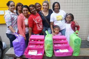 Mothers getting donation of working tools