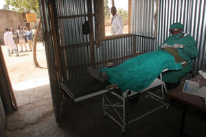 Eye Care Worker Performing Surgery on a Patient