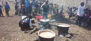 Cooking more pporridge in lushagala IDP Camp