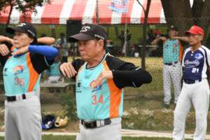 Mr. Tsai warming up with teammates