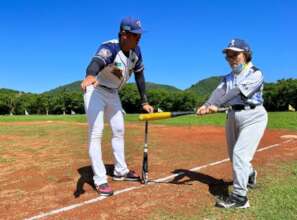 Grandma Yu, polishing her swing on the field