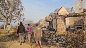 Staff reflecting on the Ruins after the fire