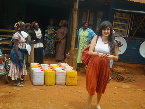 Hannah and the women receving oil at the warehouse