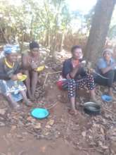 women under trees