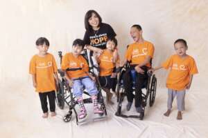 Ms Valencia (The Founder of RHI) and sick children
